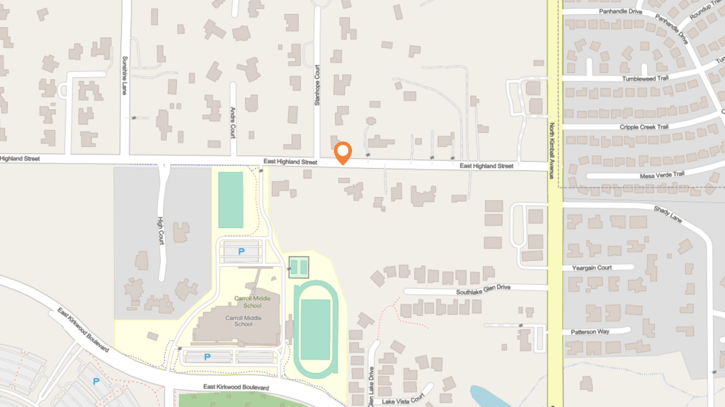 Map showing East Highland Street intersecting with several small roads. A location pin marks a spot slightly north of East Highland Street, near residential areas and a large school complex to the southwest.